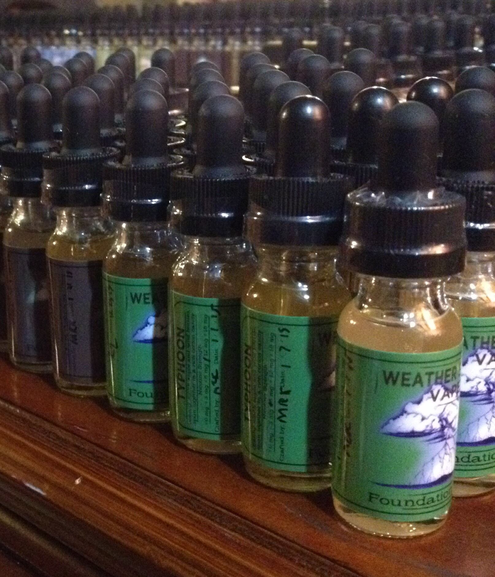 Bottles lined up on wood table